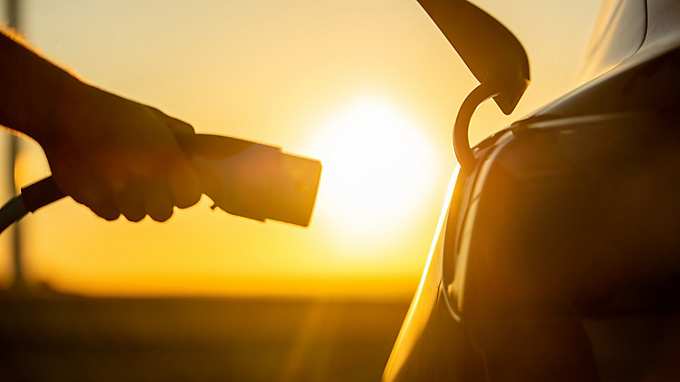 car charging at sunrise